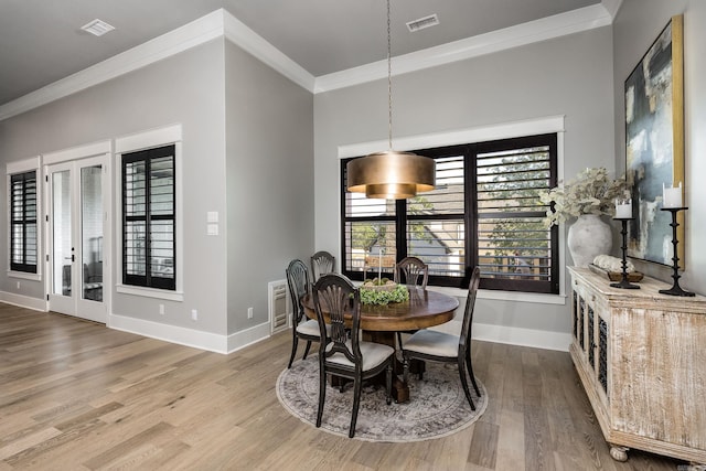 11 Haywood Ct, Little Rock, AR 72223 - dining room featuring crown molding, baseboards, and wood finished floors