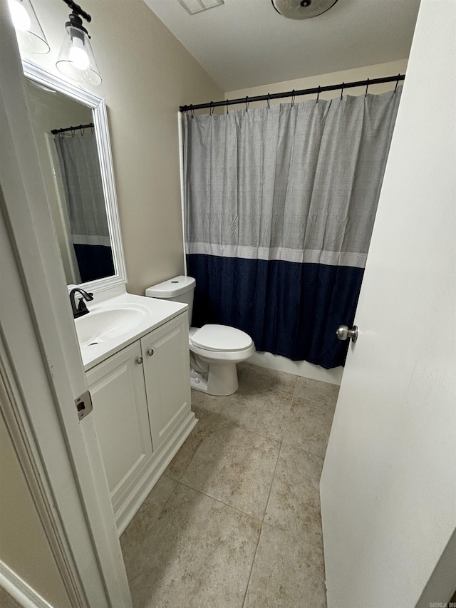 full bath with vanity, toilet, and tile patterned floors