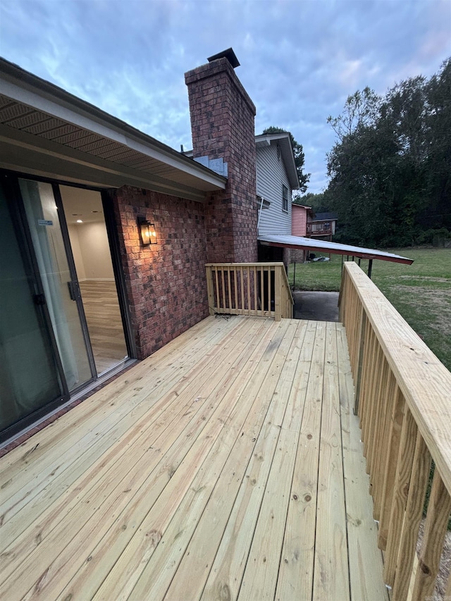 wooden terrace with a yard