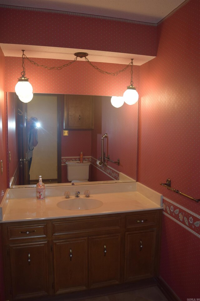 206 Beaconsfield Rd, Sherwood, AR 72120 - bathroom featuring wallpapered walls and vanity