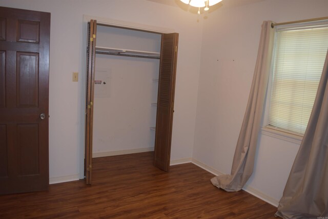206 Beaconsfield Rd, Sherwood, AR 72120 - unfurnished bedroom with dark wood finished floors, baseboards, and a closet