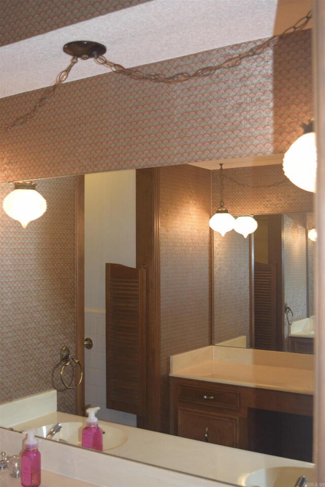 206 Beaconsfield Rd, Sherwood, AR 72120 - bathroom featuring vanity and wallpapered walls