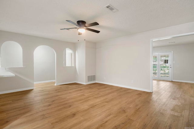 605 N W St, Morrilton, AR 72110 - unfurnished room featuring ceiling fan, light wood-style flooring, baseboards, and a textured ceiling