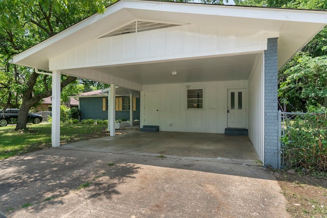 605 N W St, Morrilton, AR 72110 - view of parking / parking lot featuring driveway and an attached carport