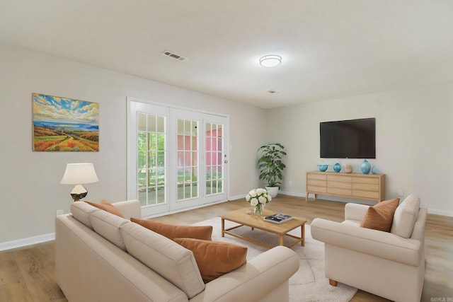 605 N W St, Morrilton, AR 72110 - living room featuring light wood-style floors and baseboards