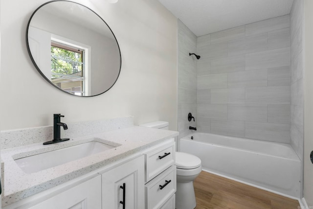 605 N W St, Morrilton, AR 72110 - full bath featuring toilet, vanity, wood finished floors, and shower / bathtub combination