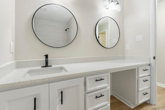 605 N W St, Morrilton, AR 72110 - bathroom featuring vanity and wood finished floors
