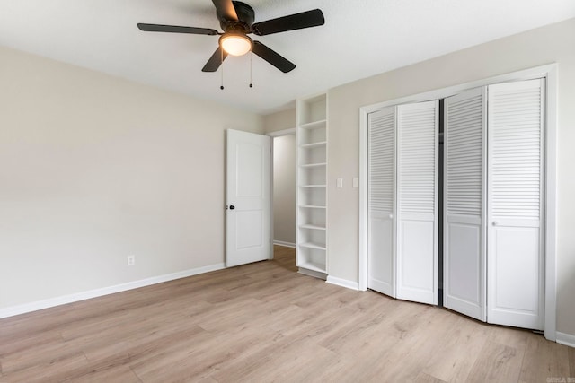 605 N W St, Morrilton, AR 72110 - unfurnished bedroom with light wood finished floors, a closet, and baseboards