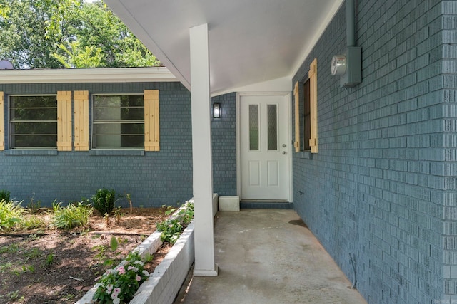 605 N W St, Morrilton, AR 72110 - doorway to property with brick siding