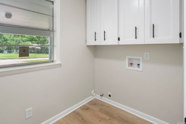 605 N W St, Morrilton, AR 72110 - washroom with washer hookup, cabinet space, light wood-style flooring, hookup for an electric dryer, and baseboards