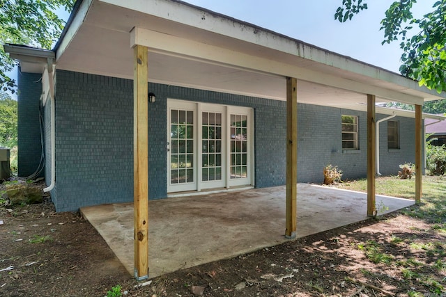 605 N W St, Morrilton, AR 72110 - back of property featuring brick siding and a patio area