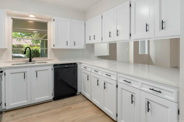 605 N W St, Morrilton, AR 72110 - kitchen featuring dishwasher, a sink, backsplash, white cabinetry, and light wood finished floors