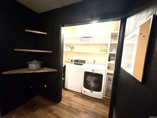 28 Timothy Ln, Conway, AR 72034 - laundry area with washing machine and dryer and wood finished floors