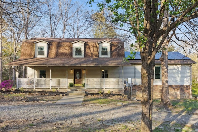 10626 Pineview Dr, Mabelvale, AR 72103 - view of front of home with covered porch and solar panels