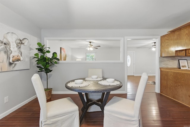 10626 Pineview Dr, Mabelvale, AR 72103 - dining area featuring a ceiling fan, dark wood-style flooring, and baseboards