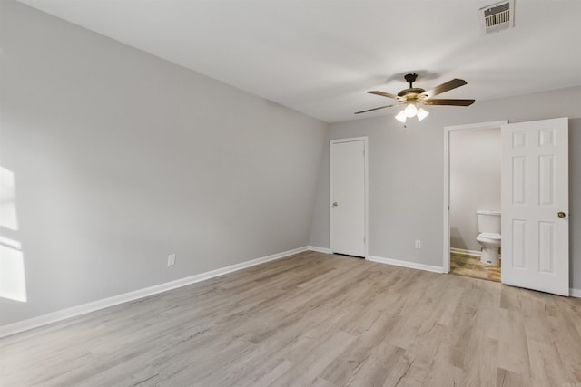 10626 Pineview Dr, Mabelvale, AR 72103 - unfurnished bedroom with light wood finished floors, baseboards, ensuite bath, and a ceiling fan
