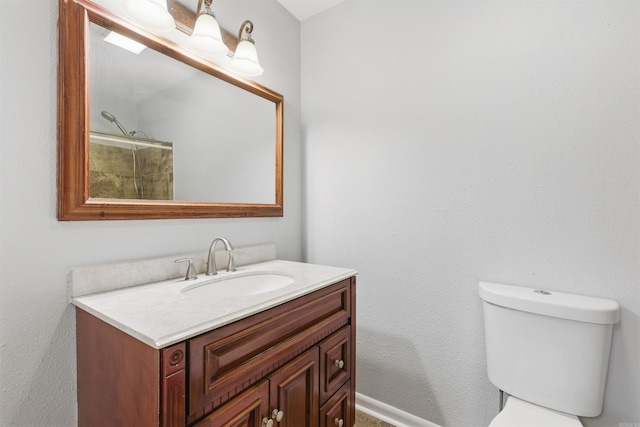 10626 Pineview Dr, Mabelvale, AR 72103 - bathroom with vanity, toilet, and baseboards