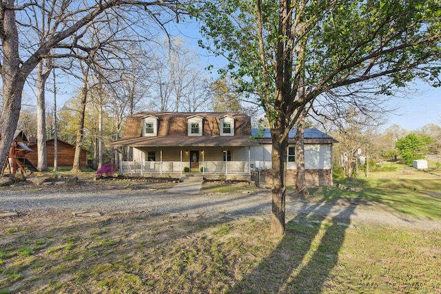 10626 Pineview Dr, Mabelvale, AR 72103 - view of front of property with covered porch and solar panels