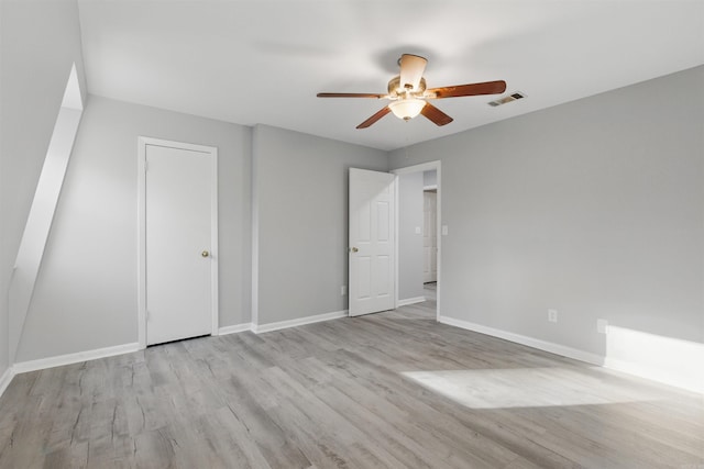 10626 Pineview Dr, Mabelvale, AR 72103 - unfurnished bedroom with wood finished floors, baseboards, and ceiling fan