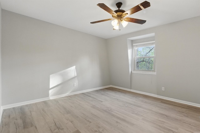 10626 Pineview Dr, Mabelvale, AR 72103 - spare room featuring wood finished floors, baseboards, and ceiling fan