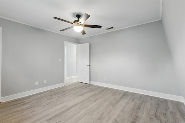 10626 Pineview Dr, Mabelvale, AR 72103 - spare room featuring crown molding, light wood-type flooring, a ceiling fan, and baseboards