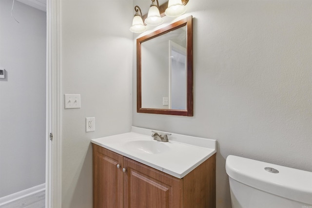 10626 Pineview Dr, Mabelvale, AR 72103 - bathroom with vanity, toilet, and a chandelier
