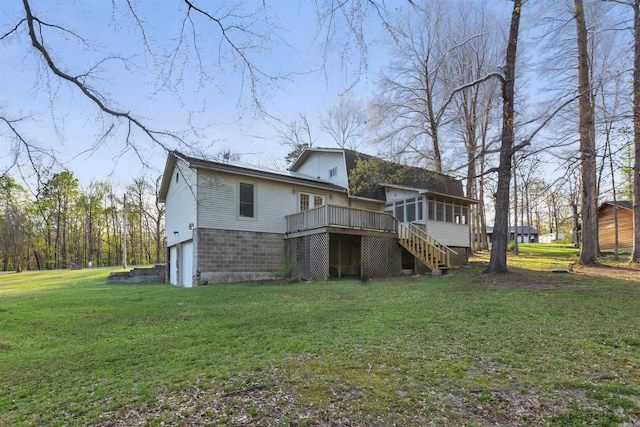 10626 Pineview Dr, Mabelvale, AR 72103 - rear view of house with a sunroom, a garage, stairs, a deck, and a yard