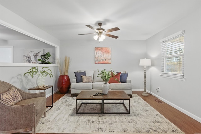 10626 Pineview Dr, Mabelvale, AR 72103 - living room with a ceiling fan, baseboards, and wood finished floors