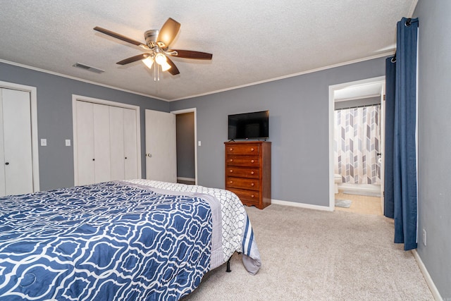 1211 Janwood St, El Dorado, AR 71730 - bedroom with a textured ceiling, carpet floors, multiple closets, crown molding, and ceiling fan