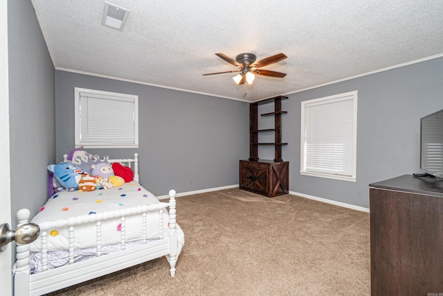 1211 Janwood St, El Dorado, AR 71730 - bedroom featuring carpet, ornamental molding, a textured ceiling, ceiling fan, and baseboards
