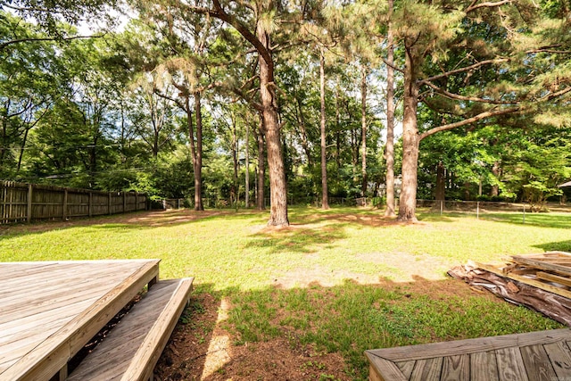 1211 Janwood St, El Dorado, AR 71730 - view of yard with a deck and view of scattered trees