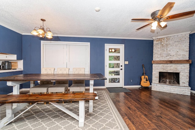 1211 Janwood St, El Dorado, AR 71730 - dining space with a textured ceiling, ornamental molding, wood finished floors, a chandelier, and ceiling fan