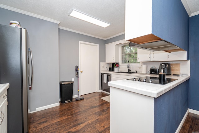 1211 Janwood St, El Dorado, AR 71730 - kitchen featuring freestanding refrigerator, black electric cooktop, dark wood-style flooring, crown molding, and dishwashing machine
