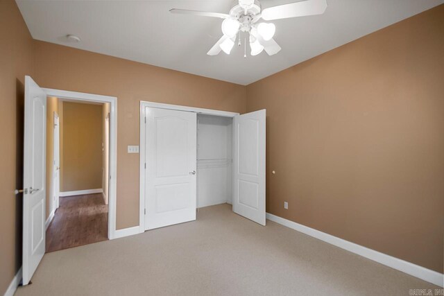 36 Brentwood Cv, Cabot, AR 72023 - unfurnished bedroom featuring light colored carpet, baseboards, a closet, and a ceiling fan