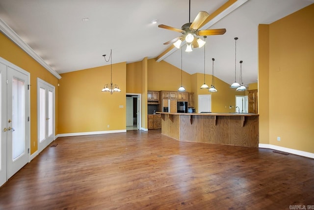 36 Brentwood Cv, Cabot, AR 72023 - kitchen with beam ceiling, a peninsula, a kitchen breakfast bar, wood finished floors, and baseboards