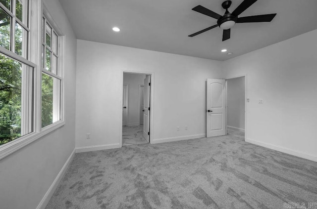2311 S Louisiana St, Little Rock, AR 72206 - unfurnished bedroom with multiple windows, recessed lighting, baseboards, carpet floors, and connected bathroom