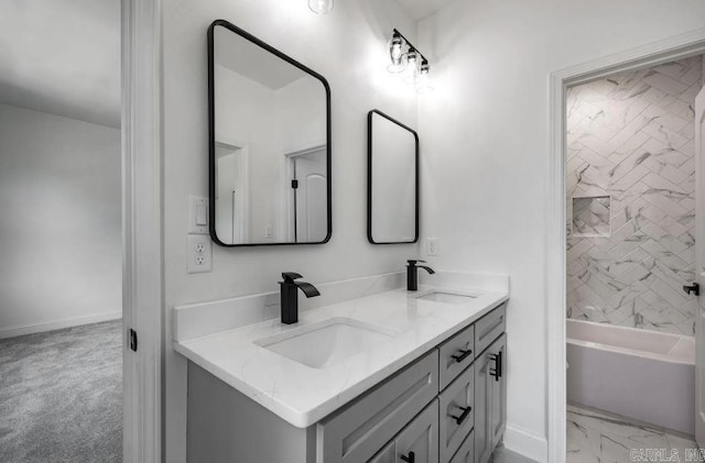 2311 S Louisiana St, Little Rock, AR 72206 - full bath with double vanity, marble finish flooring, baseboards, and washtub / shower combination