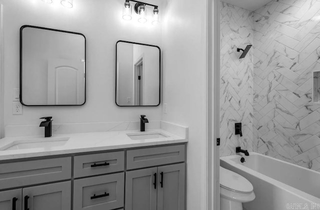 2311 S Louisiana St, Little Rock, AR 72206 - bathroom with double vanity, toilet, and tub / shower combination