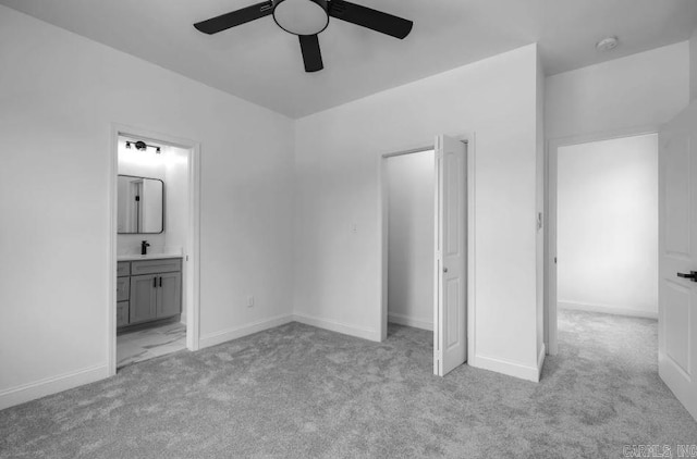 2311 S Louisiana St, Little Rock, AR 72206 - unfurnished bedroom with light colored carpet, connected bathroom, ceiling fan, and baseboards