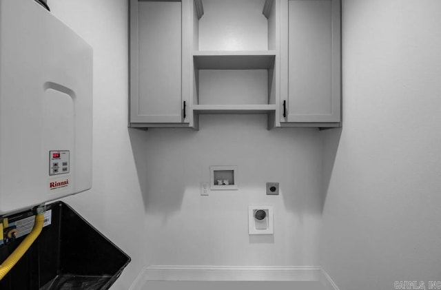 2311 S Louisiana St, Little Rock, AR 72206 - laundry area featuring hookup for an electric dryer, cabinet space, hookup for a washing machine, and water heater