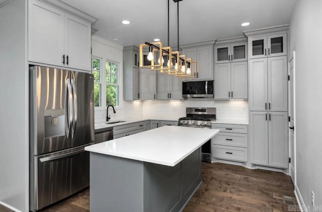 2311 S Louisiana St, Little Rock, AR 72206 - kitchen with stainless steel appliances, a sink, tasteful backsplash, light countertops, and ornamental molding