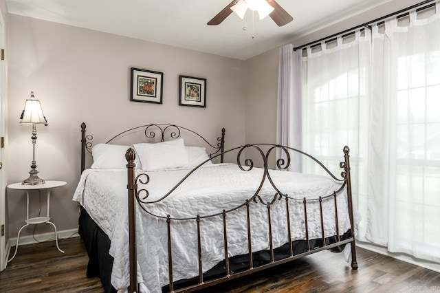 2130 Maplewood Dr, Conway, AR 73034 - bedroom featuring wood finished floors, a ceiling fan, and baseboards