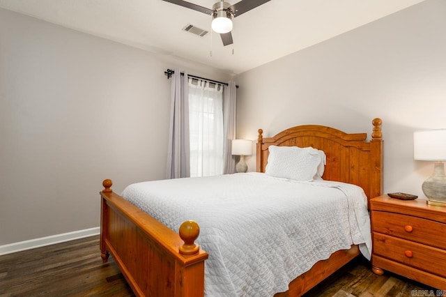 2130 Maplewood Dr, Conway, AR 73034 - bedroom with baseboards, wood finished floors, and a ceiling fan