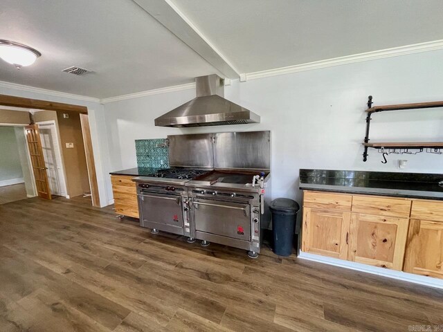 3804 Ridge Rd, North Little Rock, AR 72116 - kitchen with wall chimney range hood, crown molding, dark wood-style floors, dark countertops, and tasteful backsplash