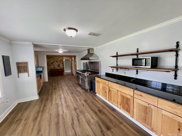 3804 Ridge Rd, North Little Rock, AR 72116 - kitchen with wall chimney range hood, appliances with stainless steel finishes, dark wood-type flooring, crown molding, and dark countertops