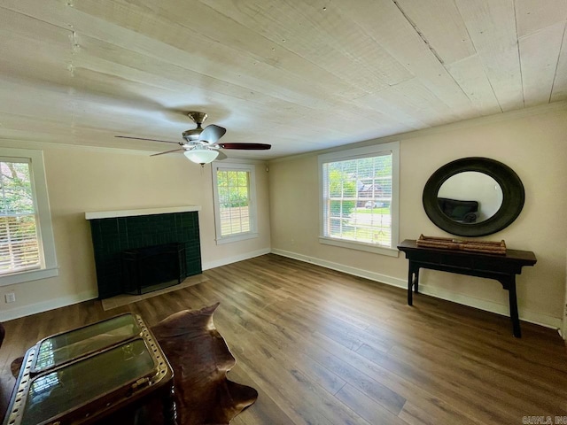 3804 Ridge Rd, North Little Rock, AR 72116 - living room featuring wood finished floors, a tile fireplace, baseboards, wooden ceiling, and ceiling fan