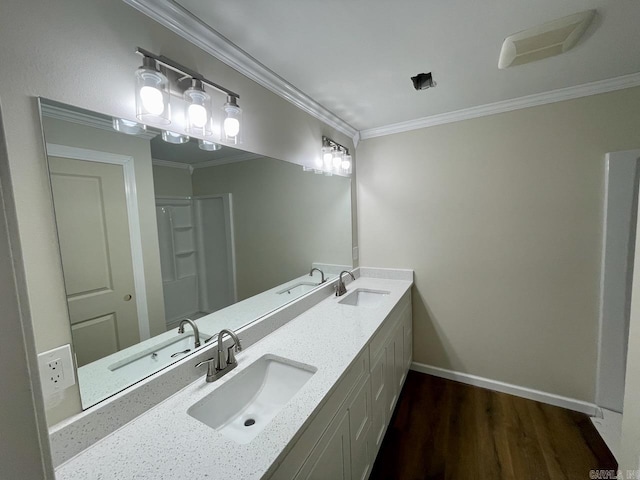 3804 Ridge Rd, North Little Rock, AR 72116 - bathroom featuring double vanity, crown molding, wood finished floors, baseboards, and a shower