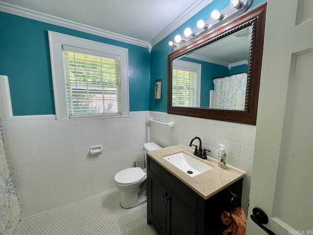3804 Ridge Rd, North Little Rock, AR 72116 - full bathroom featuring tile walls, vanity, toilet, wainscoting, and ornamental molding
