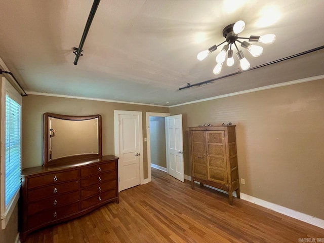 3804 Ridge Rd, North Little Rock, AR 72116 - unfurnished bedroom featuring wood finished floors, crown molding, and baseboards