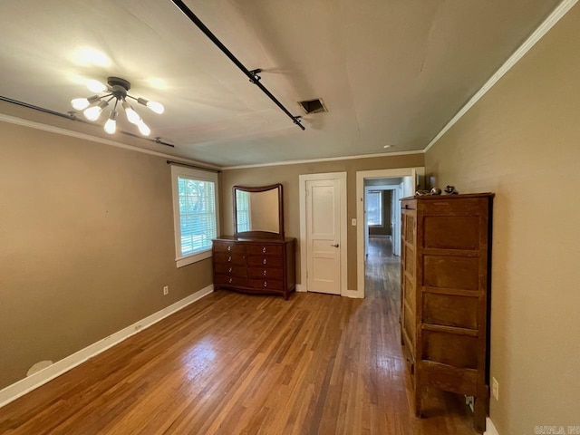 3804 Ridge Rd, North Little Rock, AR 72116 - unfurnished bedroom featuring ornamental molding, wood finished floors, baseboards, and a chandelier